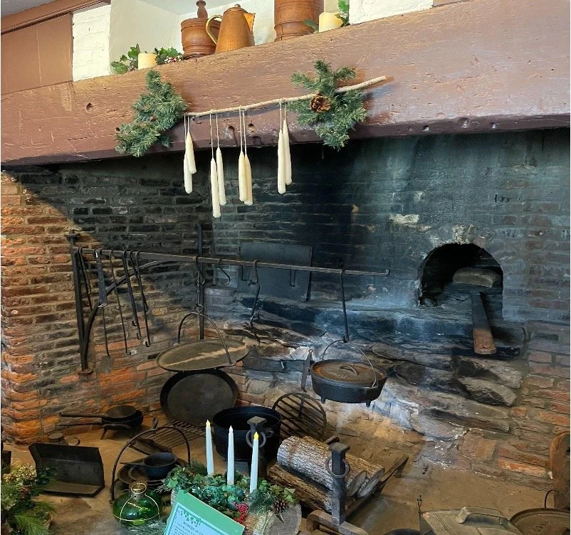 Smith’s Castle large brick Hearth oven located in the Plantation kitchen. The enslaved cooks would have used this hearth to cook the food served for the feasts of Christmastide. The large size was accommodated to feed numerous people on a large plantation, such as the family and guests who would often visit, especially during special times such as Twelfth Night.