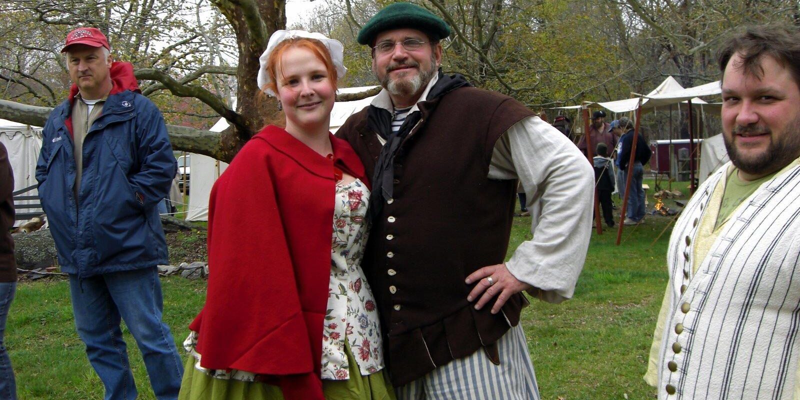 colonial pair with man in tam